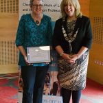 Anabel Marsh receiving honorary membership from CILIPS President Audrey Sutton