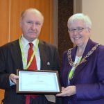 Ian McCracken accepting honorary membership from CILIPS President Margaret Menzies