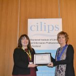 Jeanette Castle receiving honorary membership from CILIPS President Theresa Breslin