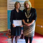 Rosemary Goring receiving honorary membership from CILIPS President Audrey Sutton