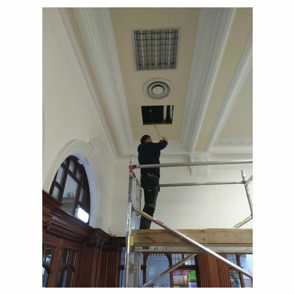 Installing LED lighting at Glasgow Women's Library, March 2021.