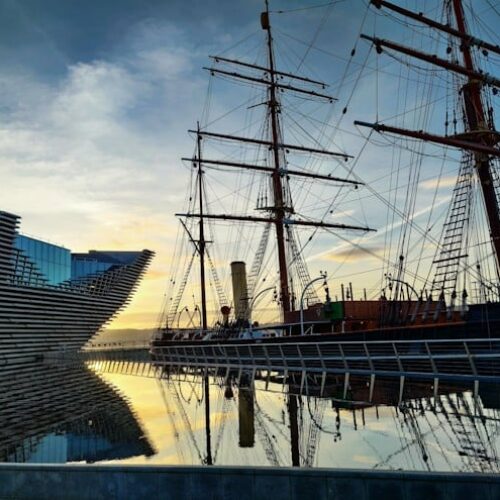 The V&A Dundee and a tall ship on the Dundee waterfront.