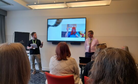 Iain Robertson and Dave Young presenting South Lanarkshire Libraries through a lens at the CILIPS Annual Conference 2023.