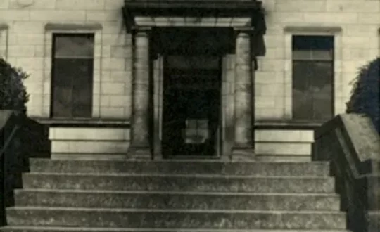 A black and white photograph of the entrance to Kircaldy Central Library.