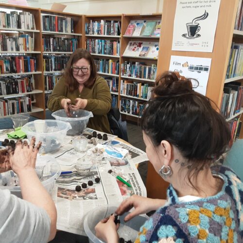 'Green Pages' workshop attendees making seed bombs in Renfrewshire Libraries.