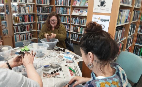 'Green Pages' workshop attendees making seed bombs in Renfrewshire Libraries.